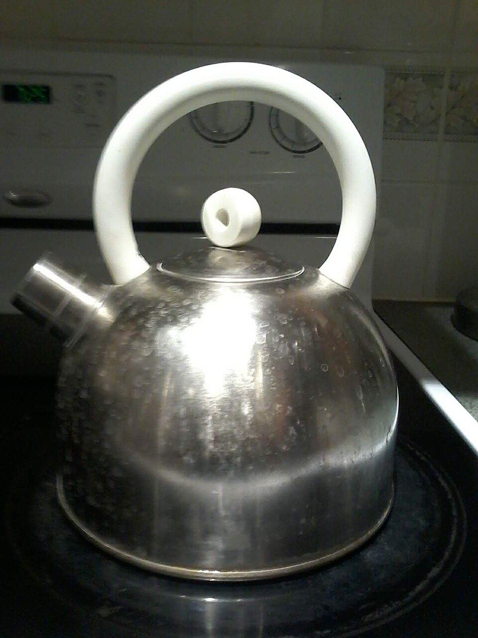 A kettle heating on a gas hob