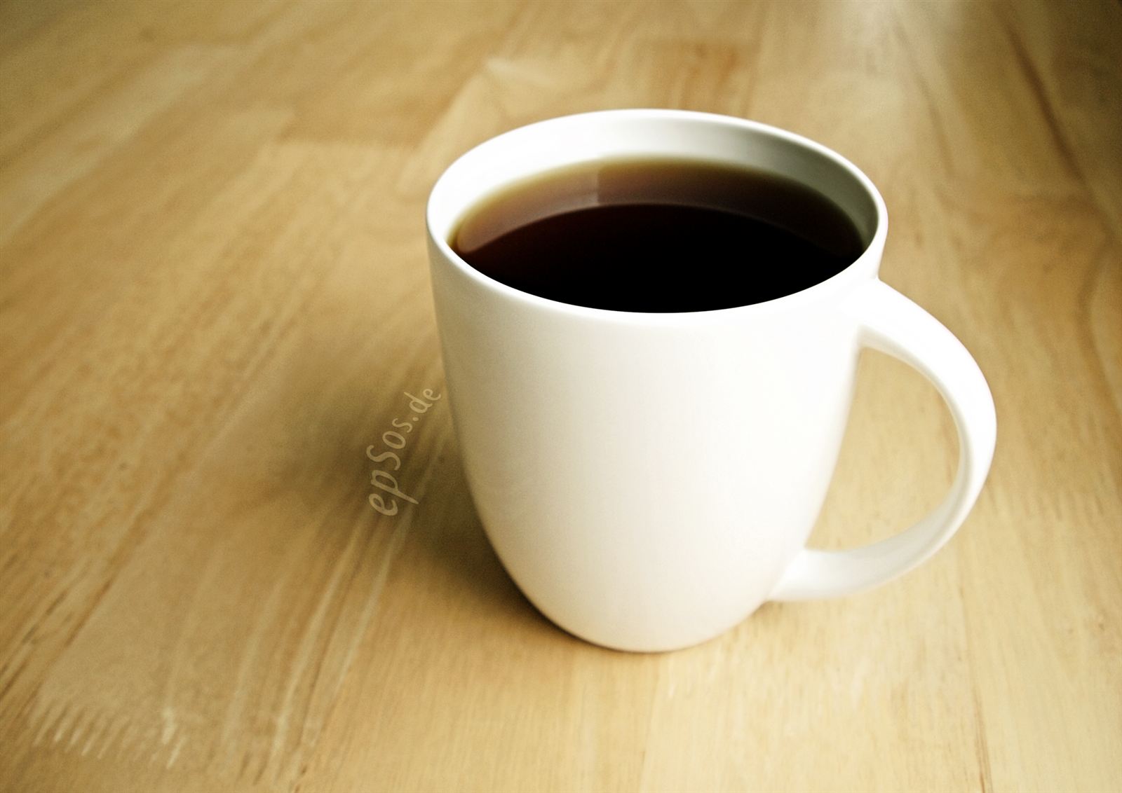 A hot drink in a white mug