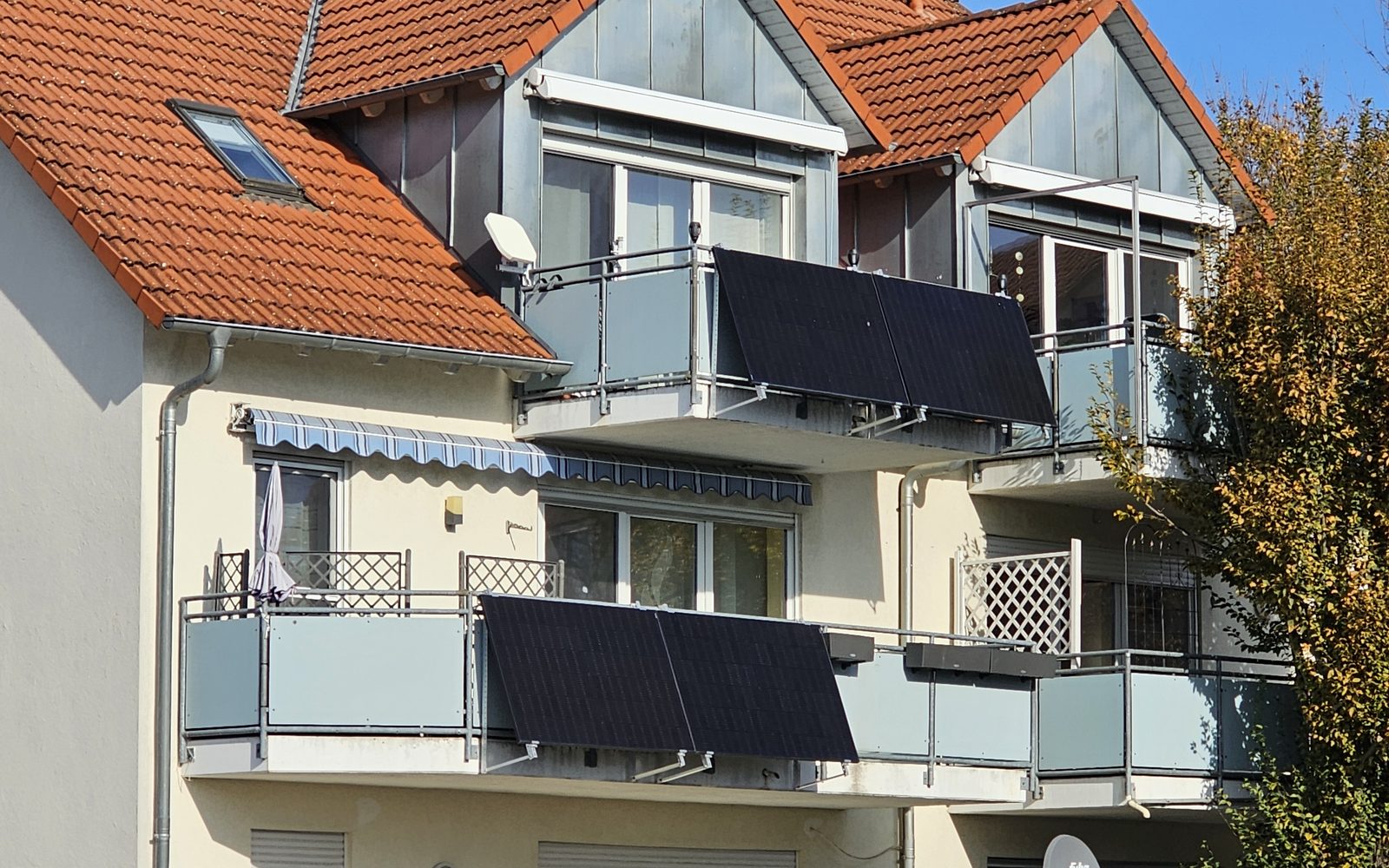 Plug-in solar panels hung on the balconies of a block of flats
